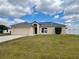 Charming single-story home featuring an attached garage and a well-maintained lawn at 351 Columbo St, Winter Haven, FL 33880