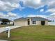 Single Gathering home with manicured lawn and an attached garage, and traditional architectural details at 351 Columbo St, Winter Haven, FL 33880