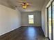 Living room showcasing the high ceilings, hardwood floors and view of the outdoors at 351 Columbo St, Winter Haven, FL 33880