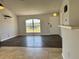 Open-concept living room with high ceilings, neutral paint and hardwood flooring at 351 Columbo St, Winter Haven, FL 33880