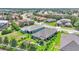 Expansive aerial view of well-maintained homes nestled in a lush, green community with mature trees and landscaping at 364 Lake Vista Dr, Auburndale, FL 33823