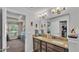 Bathroom featuring granite countertops, double sinks, and white cabinetry at 364 Lake Vista Dr, Auburndale, FL 33823