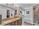 Bright bathroom with dual vanities, a soaking tub, and a separate shower area at 364 Lake Vista Dr, Auburndale, FL 33823
