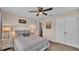 Bright bedroom with neutral tones featuring a ceiling fan and closet at 364 Lake Vista Dr, Auburndale, FL 33823