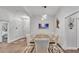 Dining room boasts a large table with seating for six, modern decor, and lots of natural light at 364 Lake Vista Dr, Auburndale, FL 33823