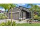 Exterior showcasing a well-maintained house, garage, and landscaped front yard at 364 Lake Vista Dr, Auburndale, FL 33823
