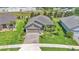 Beautiful home with a two-car garage, lush landscaping, and a manicured lawn for excellent curb appeal at 364 Lake Vista Dr, Auburndale, FL 33823