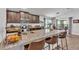Kitchen featuring granite countertops, a breakfast bar, and stainless steel appliances at 364 Lake Vista Dr, Auburndale, FL 33823