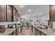 A well-lit kitchen with granite countertops and stainless steel appliances at 364 Lake Vista Dr, Auburndale, FL 33823