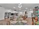 Open-concept living area with a dining table, living room, and modern kitchen at 364 Lake Vista Dr, Auburndale, FL 33823