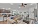 Open-concept living room, dining room, and kitchen area with modern furnishings at 364 Lake Vista Dr, Auburndale, FL 33823