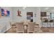 Spacious living area features a dining table with chairs, stainless steel appliances, and barstool seating at the counter at 364 Lake Vista Dr, Auburndale, FL 33823