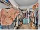 Spacious walk-in closet with ample shelving and storage space for clothes and accessories at 364 Lake Vista Dr, Auburndale, FL 33823