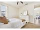 Comfortable bedroom with white furnishings, a cozy bed, and natural light from a window at 3833 Bowfin Trl, Kissimmee, FL 34746
