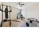 Home gym featuring exercise equipment, a punching bag, and ample workout space at 3833 Bowfin Trl, Kissimmee, FL 34746