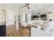 Inviting living room with an open concept, wood-look tile floors, and neutral color palette at 3833 Bowfin Trl, Kissimmee, FL 34746