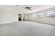 A spacious loft with three windows and an additional sitting area at 3833 Bowfin Trl, Kissimmee, FL 34746