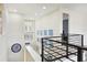 A bright and airy loft features an indoor balcony and modern decor at 3833 Bowfin Trl, Kissimmee, FL 34746