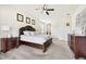 Spacious main bedroom features a well-appointed layout, dark wood furnishings, and neutral decor at 3833 Bowfin Trl, Kissimmee, FL 34746
