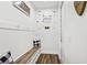 Inviting mudroom features charming decor and convenient bench seating, perfect for pet lovers at 3833 Bowfin Trl, Kissimmee, FL 34746