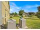 Backyard view with playset and home's exterior, including AC unit at 3853 Cortland Dr, Davenport, FL 33837