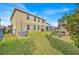 A spacious backyard with a playset adjacent to home's back exterior at 3853 Cortland Dr, Davenport, FL 33837