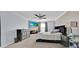 Relaxing bedroom with a fireplace, accent wall and modern furniture and decor at 3853 Cortland Dr, Davenport, FL 33837