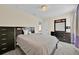Neutral bedroom with a comfortable gray bed, soft carpet, and lots of storage at 3853 Cortland Dr, Davenport, FL 33837