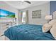 Comfortable bedroom features a TV, a large bed, and coordinating decor at 3853 Cortland Dr, Davenport, FL 33837