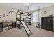 A bedroom featuring a unique bunk bed with a slide, dinosaur-themed decor and carpeted floors at 3853 Cortland Dr, Davenport, FL 33837