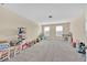 Upstairs bonus room with plush carpeting and lots of floor space for activities at 3853 Cortland Dr, Davenport, FL 33837