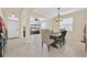 Open concept dining room with view to front door, living areas, and black shelving at 3853 Cortland Dr, Davenport, FL 33837