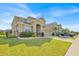 Lovely two-story home with a well-maintained lawn and landscaped garden beds at 3853 Cortland Dr, Davenport, FL 33837