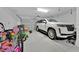 Two car garage with large SUV, and overhead door at 3853 Cortland Dr, Davenport, FL 33837