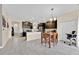 Spacious kitchen area featuring dark cabinets, stainless appliances, and tile floors at 3853 Cortland Dr, Davenport, FL 33837