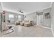 Bright living room featuring tile floors, neutral walls, and comfortable seating at 3853 Cortland Dr, Davenport, FL 33837