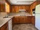 Traditional kitchen with ample cabinet space and tiled floor at 3949 Millstone St, Lake Wales, FL 33898