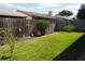 Backyard with a green lawn and a wooden fence at 4007 Cypress Lndg S, Winter Haven, FL 33884