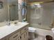 Bathroom features neutral color scheme, a bath and shower combination and a vanity at 4007 Cypress Lndg S, Winter Haven, FL 33884