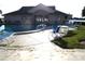 Enjoy the community pool with ample seating, perfect for relaxation and socializing at 4007 Cypress Lndg S, Winter Haven, FL 33884