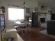Cozy dining area with lots of natural light and fireplace at 4007 Cypress Lndg S, Winter Haven, FL 33884