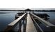 Community dock provides easy access to the lake, perfect for fishing or boating activities at 4007 Cypress Lndg S, Winter Haven, FL 33884