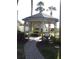 Gazebo with a brick path and a manicured lawn at 4007 Cypress Lndg S, Winter Haven, FL 33884
