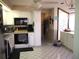 Bright kitchen featuring white cabinetry, offering ample storage at 4007 Cypress Lndg S, Winter Haven, FL 33884