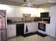Well-equipped kitchen with modern appliances and ample counter space at 4007 Cypress Lndg S, Winter Haven, FL 33884