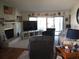 Spacious living room with fireplace and sliding glass doors at 4007 Cypress Lndg S, Winter Haven, FL 33884