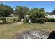Large backyard with mature trees and fencing offering privacy at 403 Se 3Rd St, Fort Meade, FL 33841