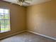Bedroom with plush carpeting and a large window providing natural light at 403 Se 3Rd St, Fort Meade, FL 33841