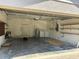 Spacious garage with laundry area, water heater, storage shelves and room for two cars at 403 Se 3Rd St, Fort Meade, FL 33841