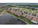 An aerial view of a home near a beautiful pond at 4081 Dunmore Dr, Lake Wales, FL 33859